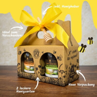 Honig Geschenkset mit Blütenhonig und Waldhonig aus der Oberpfalz in dekorativer Kartonverpackung mit gelber Schleife und Honigheber