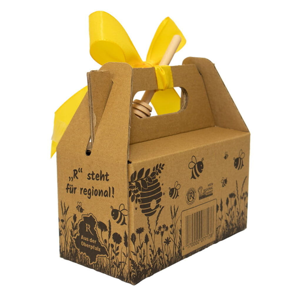 Honig Geschenkset mit Blütenhonig und Waldhonig aus der Oberpfalz in dekorativer Kartonverpackung mit gelber Schleife und Honigheber