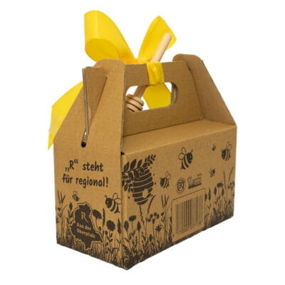 Honig Geschenkset mit Blütenhonig und Waldhonig aus der Oberpfalz in dekorativer Kartonverpackung mit gelber Schleife und Honigheber