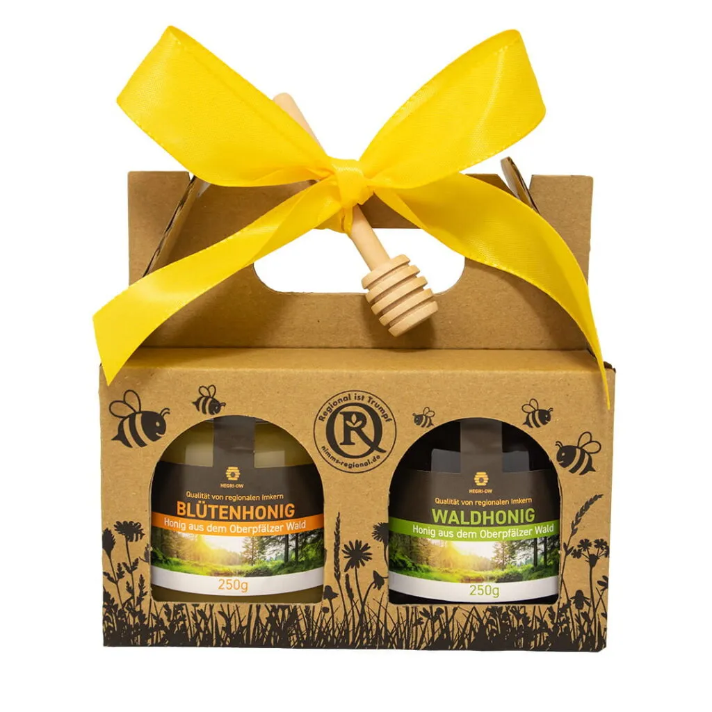 Honig Geschenkset mit Blütenhonig und Waldhonig aus der Oberpfalz in dekorativer Kartonverpackung mit gelber Schleife und Honigheber